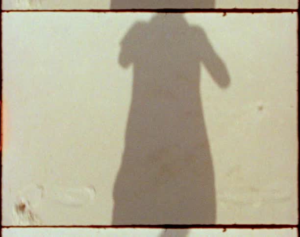 A person standing on sand