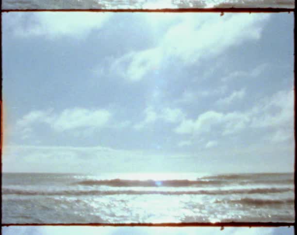 Ocean waves washing on the shore of a beach at daytime