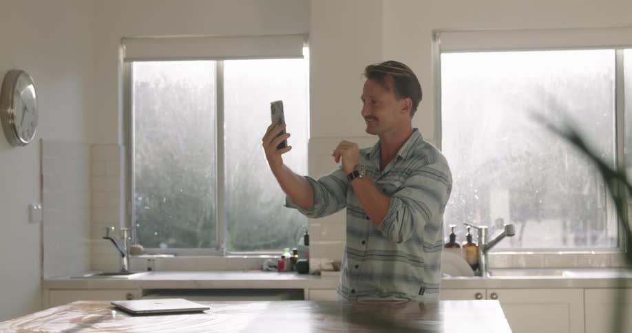 A man talking to someone on a smartphone
