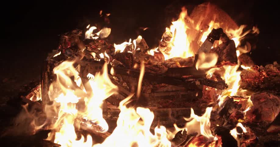 The logs are burning in the campfire
