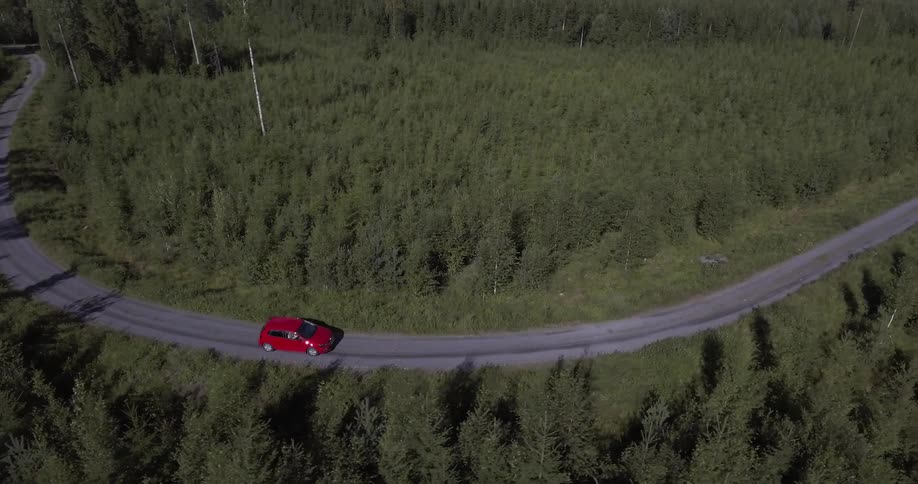 A vehicle driving along a winding road