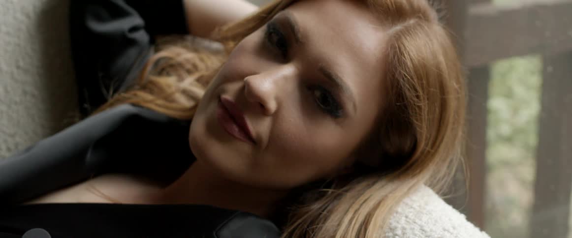 A woman is resting at home