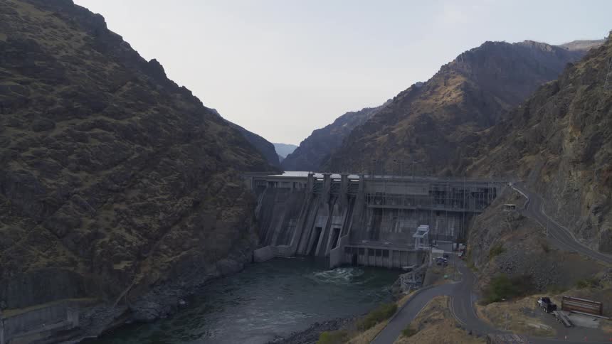 A hydro power dam discharges water while generating electricity