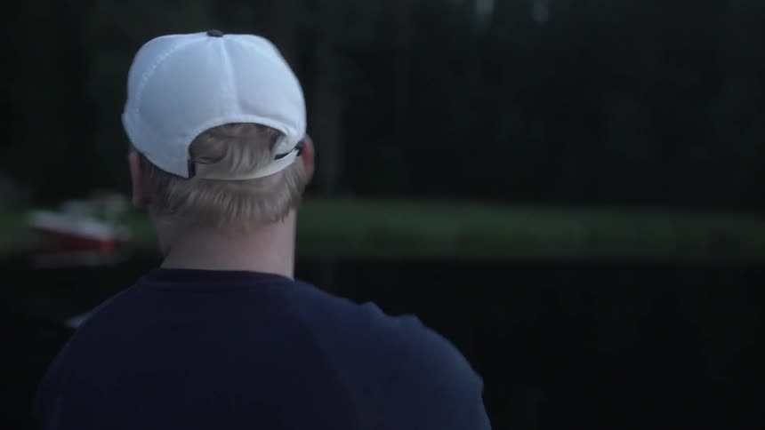 A man is fishing in a lake