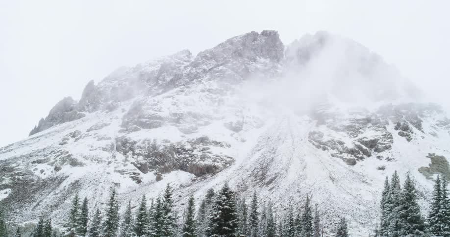 A view of a mountain with snow on it