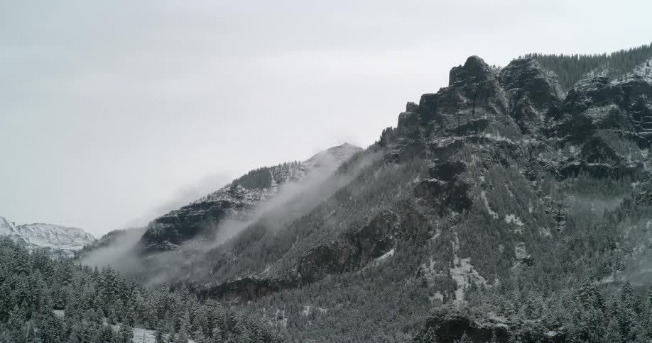 Clouds flow over the mountain range