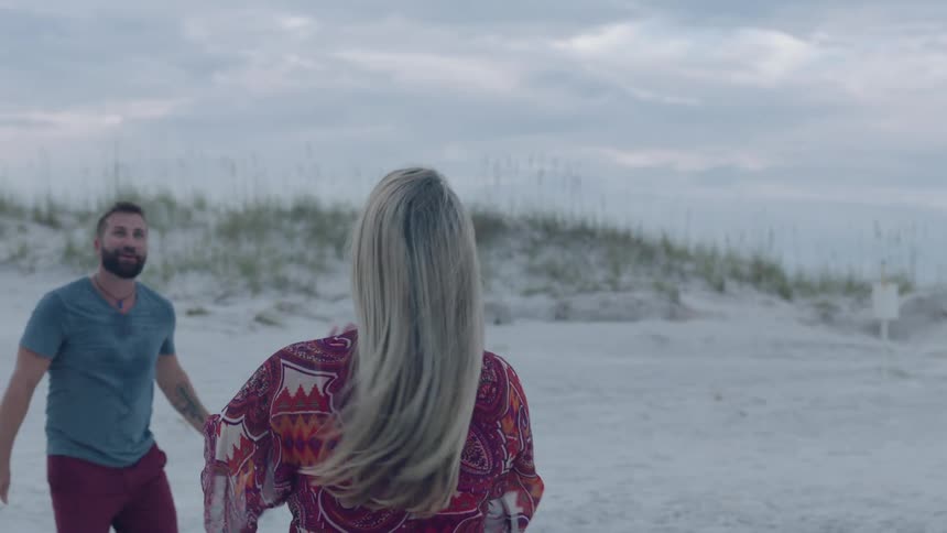 A family playing volleyball at the beach