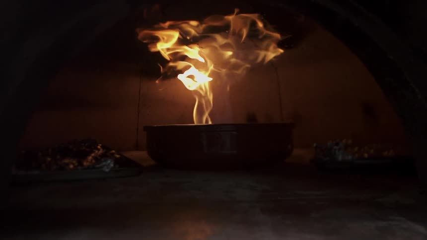 Fire flares in an oven