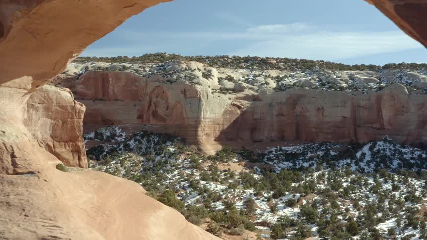 A large rock formation in nature on a winter day