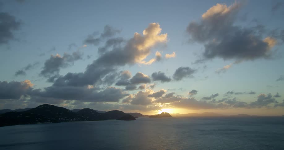The sun is rising on the horizon