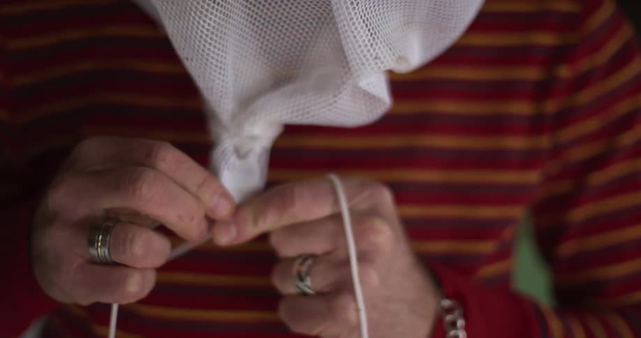 A person is tying a knot