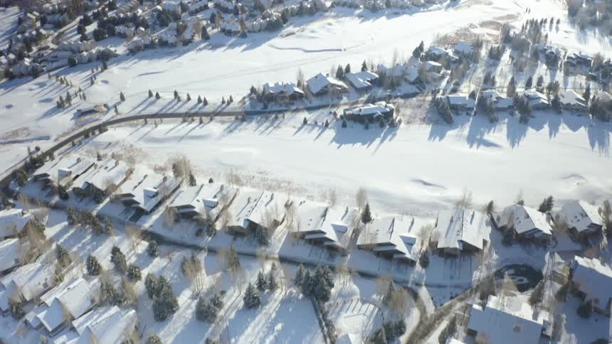 The town and the mountain are covered with snow