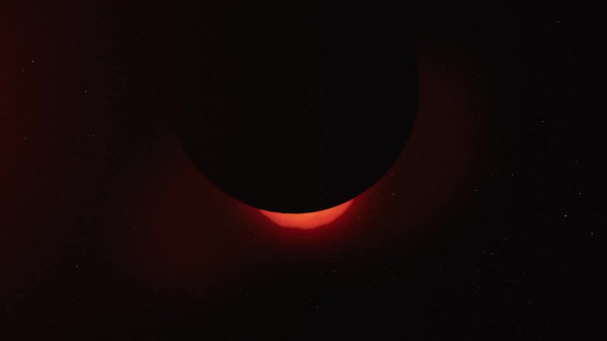 The sun with the moon moving in front of it with stars in the background