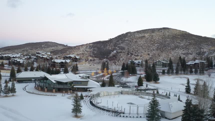 An aerial view of houses in a snowy neighborhood