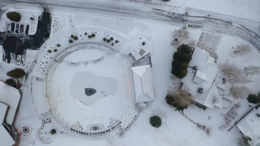The yards by the homes are covered with snow