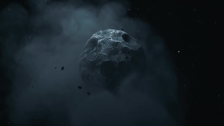An asteroid surrounded by a cloud of debris floating in space