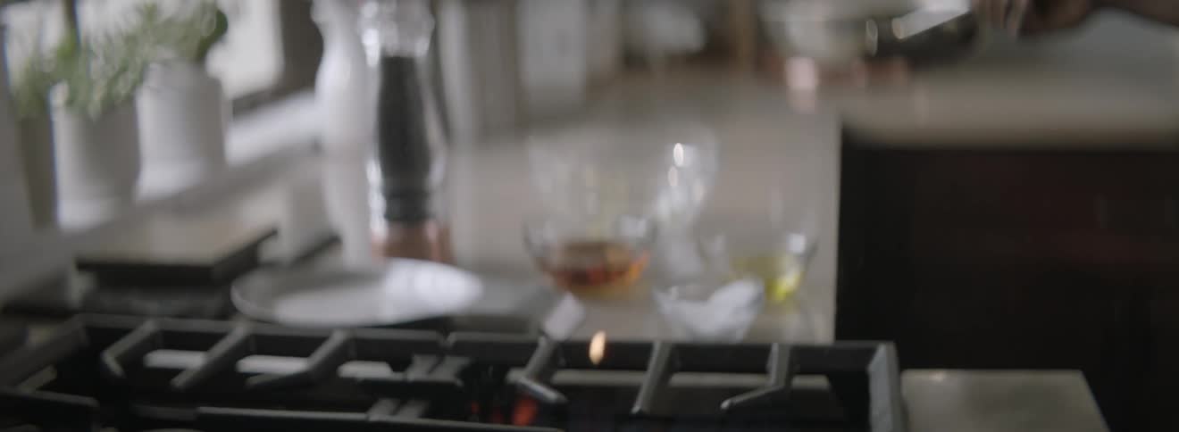 A person is cooking food on a pan
