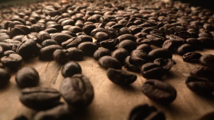Coffee beans spread out on a counter for a photo shoot