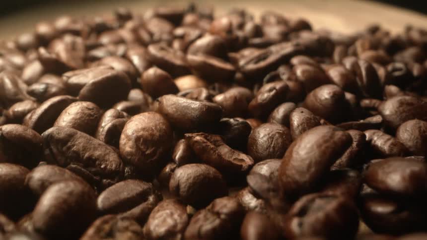 Coffee beans on a table made of wood