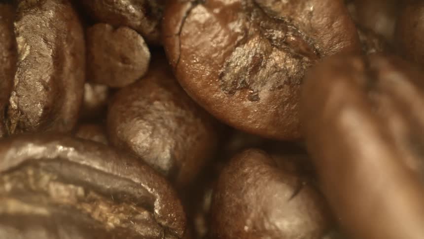 Coffee beans falling and piling up on each other