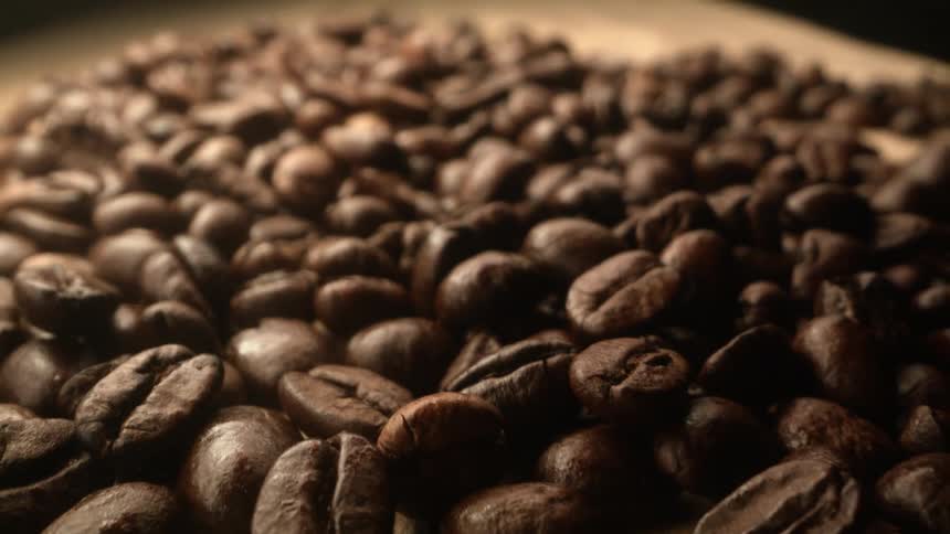 Coffee beans on a table made of wood