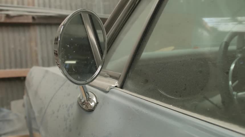 A car mirror during the day