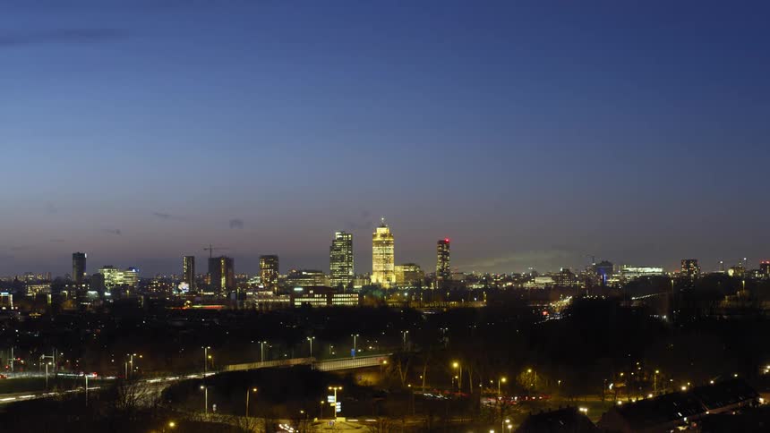 Timelapse of a city skyline from sunset to night