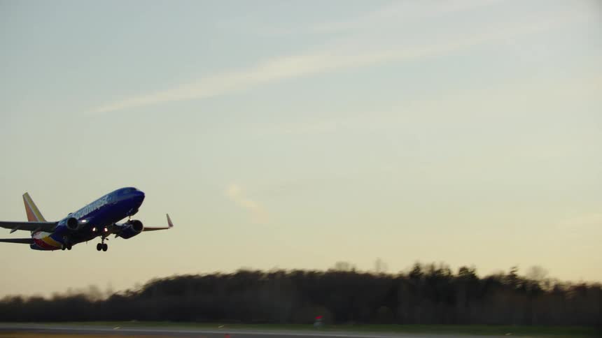 A brand new Boeing 737-Max lifts off from Paine Field at the Boeing Everett  manufacturing facility in Washington State in soft golden evening light