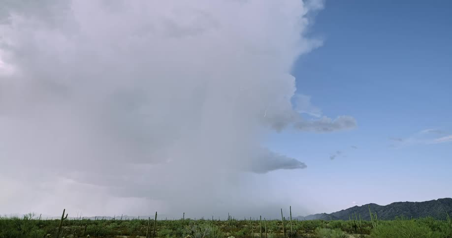 Lightning bolt from cloud hits the ground as a storm moves in