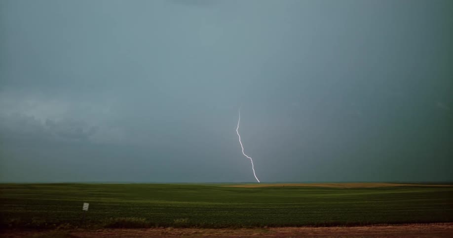 A view of lightning striking a field