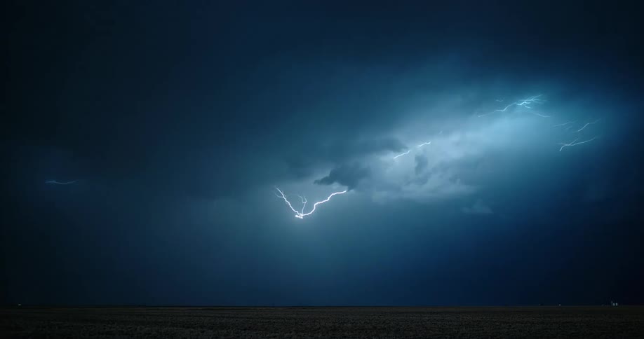 A view of lightning in clouds in the dark