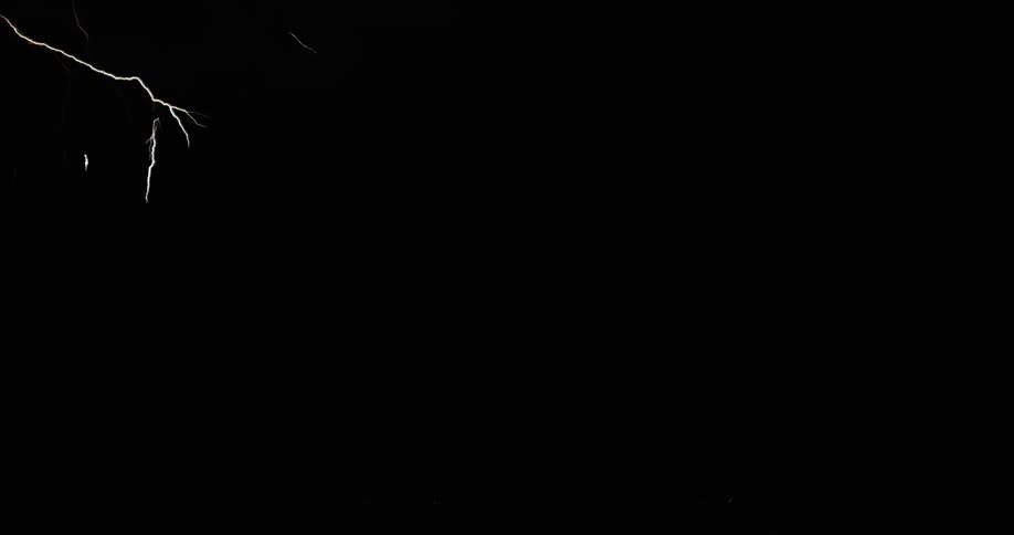 Lightning scatters into a fork and then strikes down onto the ground in a dark night sky