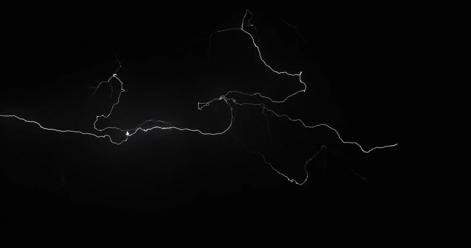 Bolts of lightning streak across a darkened sky during a powerful storm