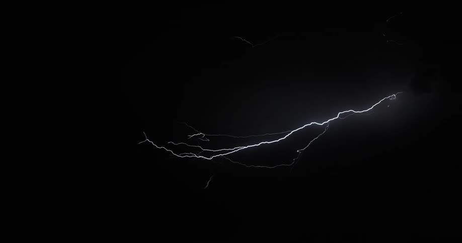 Countless bolts of lightning streak across the night sky as a violent storm looms overhead