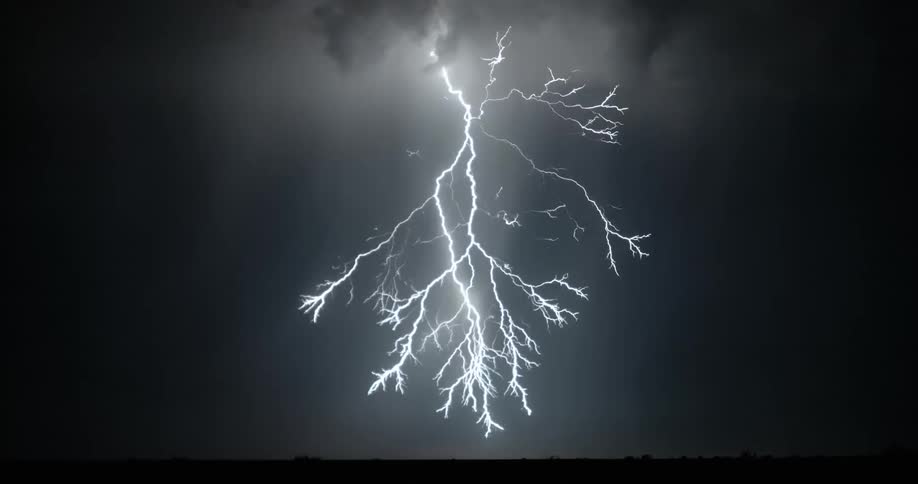 Lightning flashing in the dark sky at night