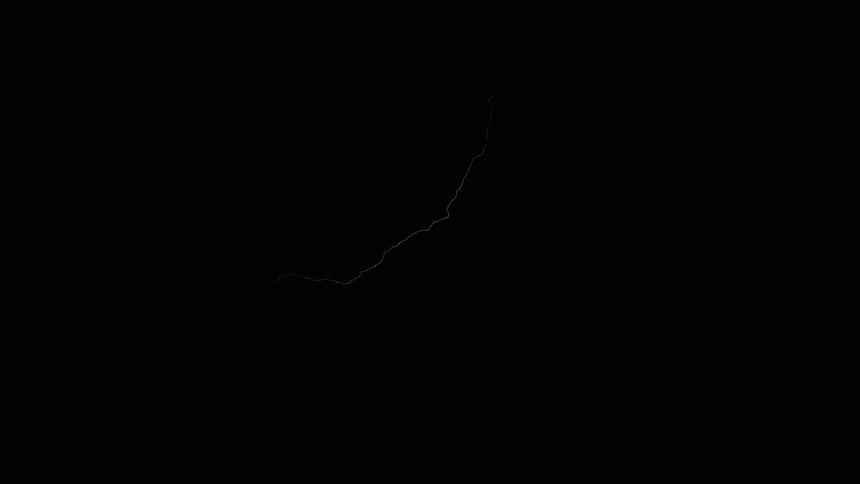 Enormous bolts of lightning descend from the sky during a powerful storm at night