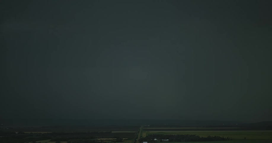 A storm with lightning with a landscape the sky and clouds in the background