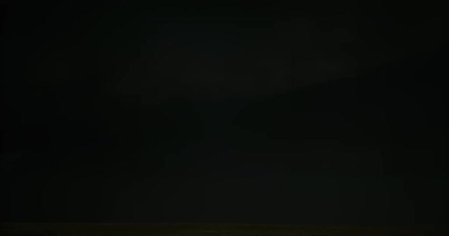 Lightning bolt flashing in a dark sky