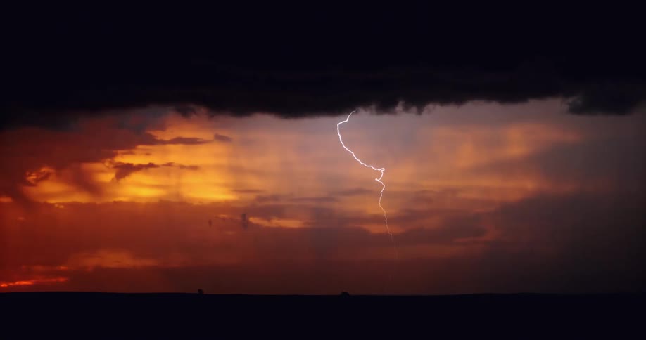 A storm is brewing in the horizon at dusk