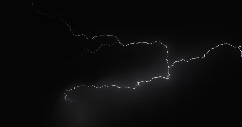 Lighting bolts flashing against the dark sky at night