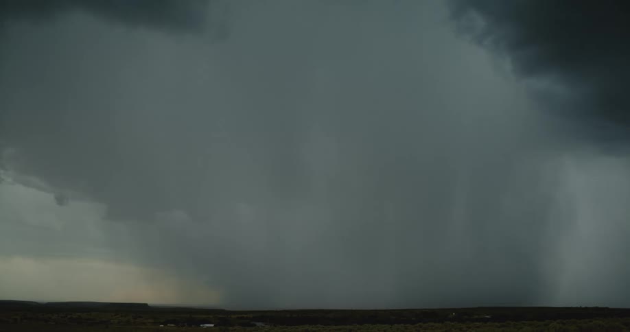 Lightning around storm cloud lighting up the sky and lighting bolt hits the ground