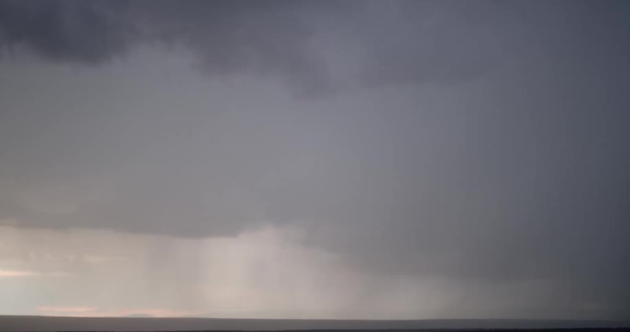 A storm with lightning with a landscape the sky and clouds in the background