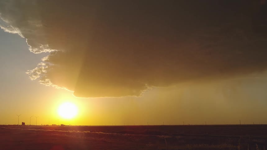 The sun is setting in the horizon