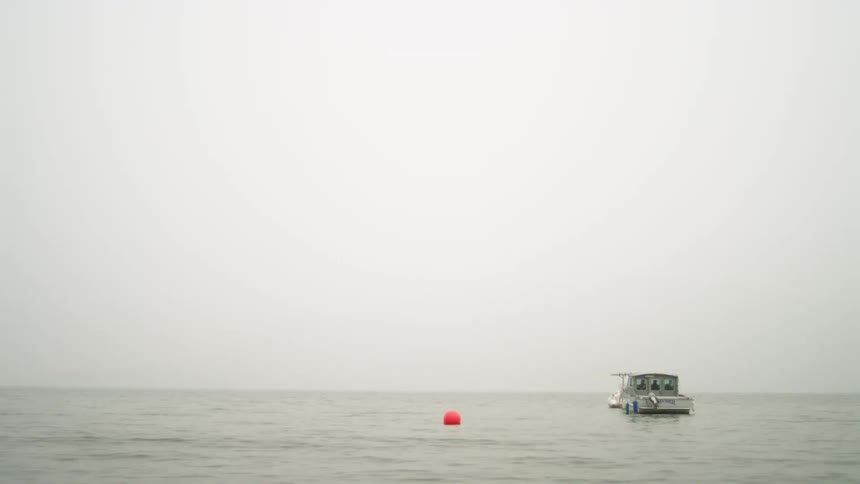 A boat is moving on the ocean during the day