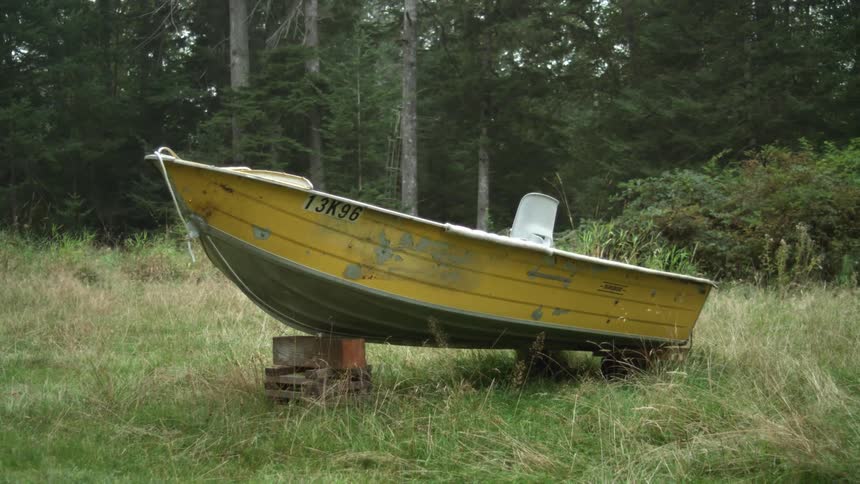 A view of a boat sitting on grass