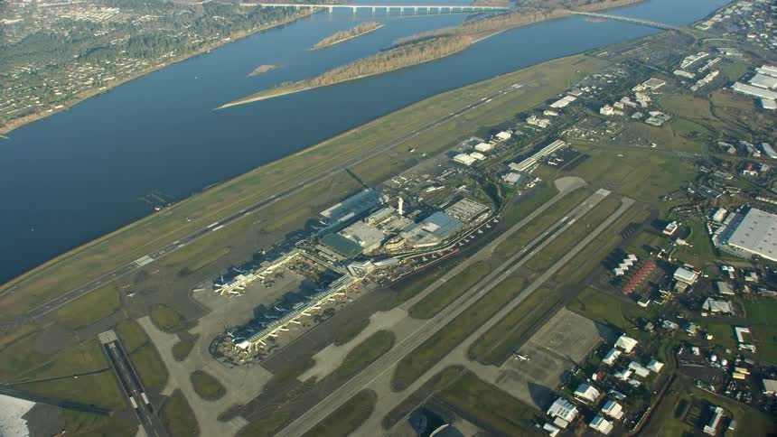 Super wide lookdown aerial of PDX Portland Oregon airport next to the Columbia River in downtown Portland Oregon