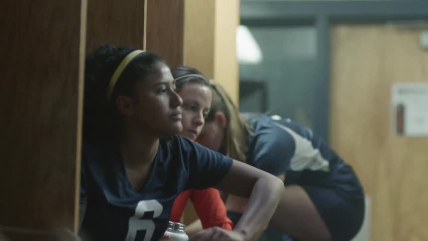 Female players get ready in the locker room