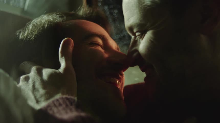 Two boyfriends kissing each other