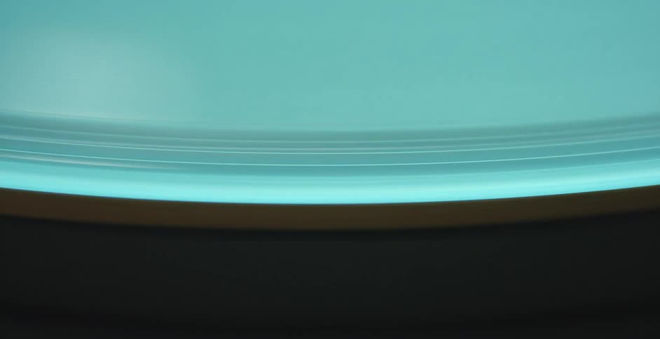 Blue brown and black colors that look like a record on a turntable