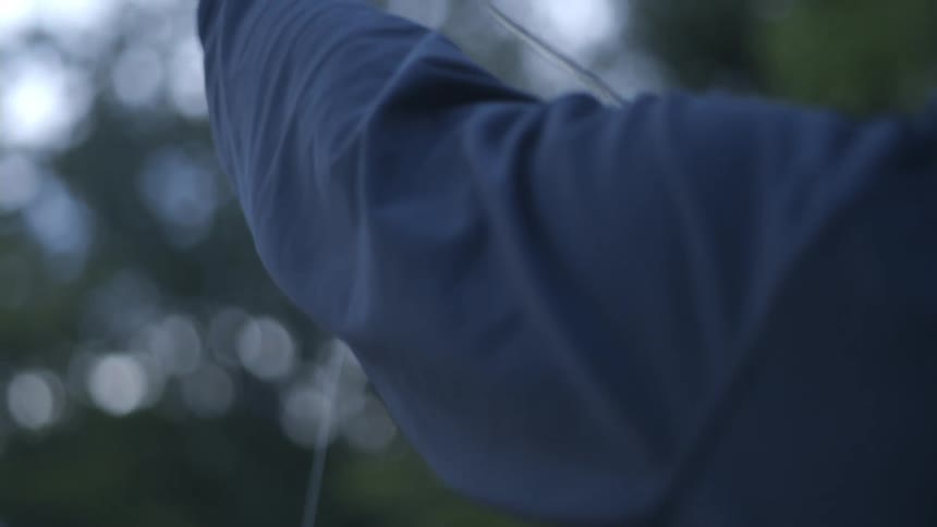 A person stretches out fishing line